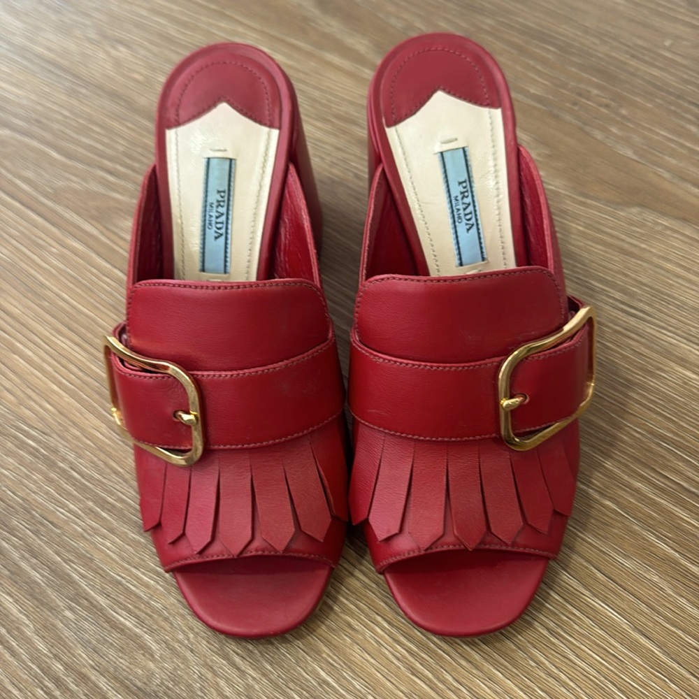 Prada red leather mules , gold buckle
